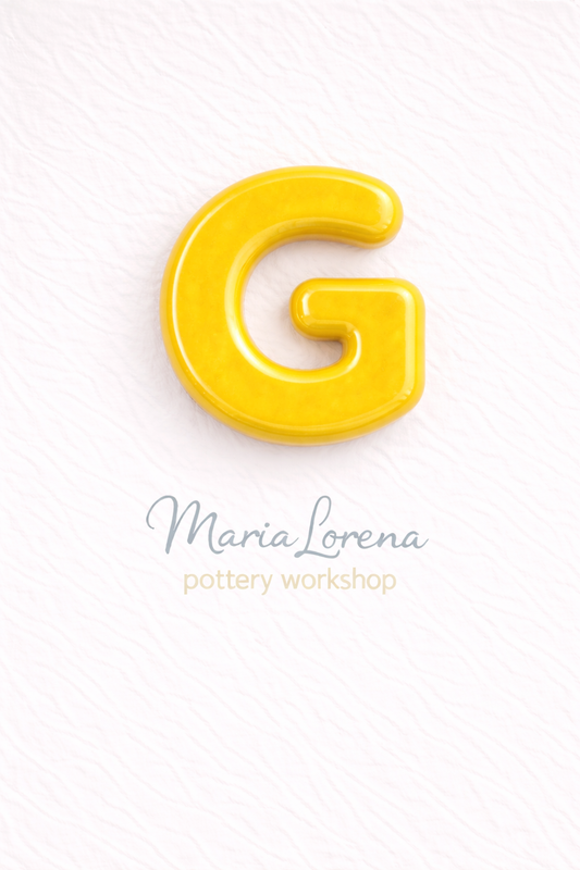 G Mayúscula amarillo